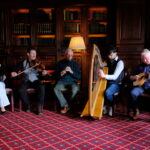 Five musicians performing in Kilronan Castle