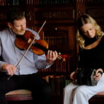 Rachel Noone, Mossie Martin and Fiachra Guihen playing in Kilronan Castle