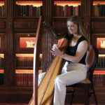 Woman playing harp in Kilronan Castle