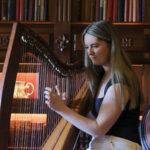 Woman playing harp in Kilronan castle