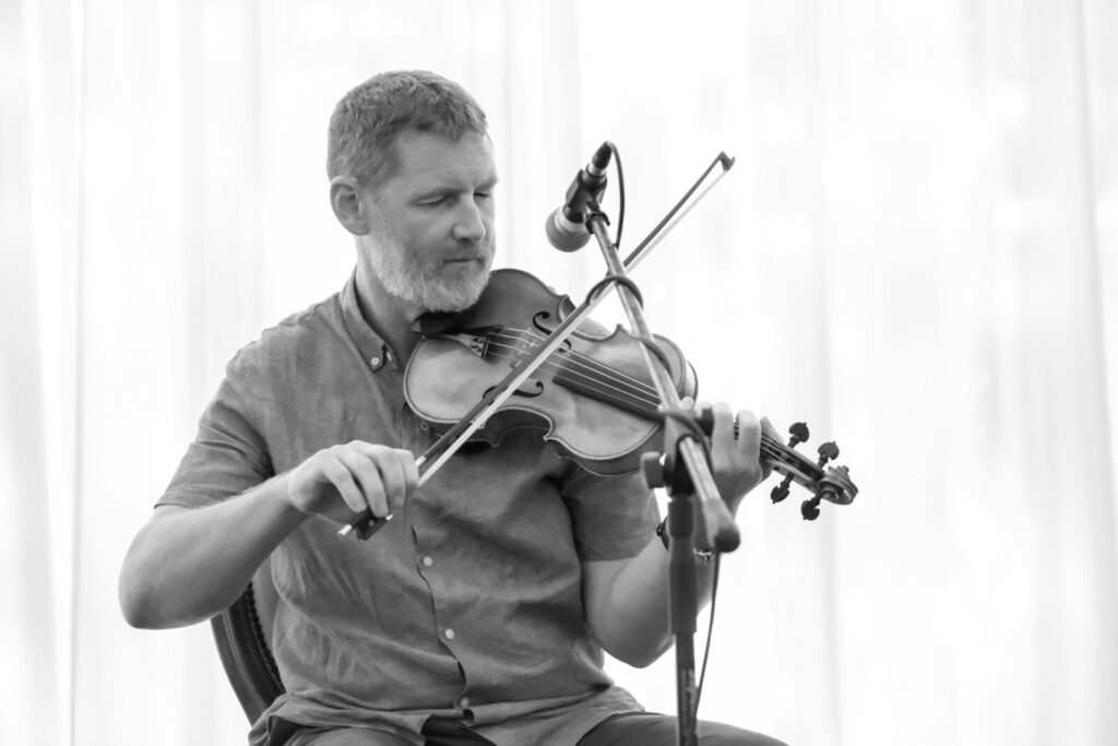 Mossie Martin playing the fiddle